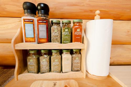 a shelf with spices and a roll of paper towels at Lake Toya Hillside House in Lake Toya