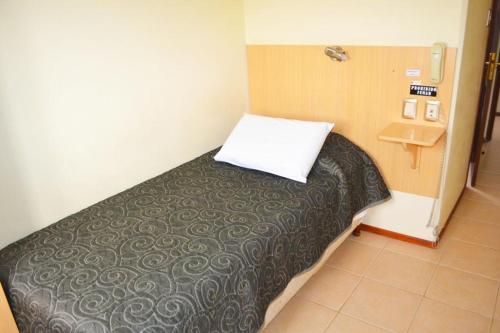 Postel nebo postele na pokoji v ubytování Hotel Argon