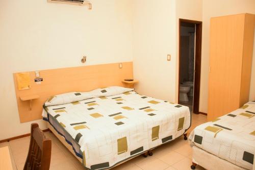 Postel nebo postele na pokoji v ubytování Hotel Argon