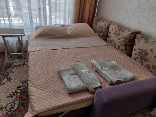 Postel nebo postele na pokoji v ubytování Студио Прованс Лариса