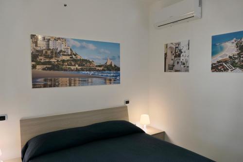 Un pat sau paturi într-o cameră la Ganimede Apartament