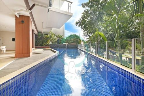 an image of a swimming pool in a villa at ZEN LUXURY: 2-Story 4-BR Penthouse in Darwin City with Mindal Markets & Harbour Views in Darwin