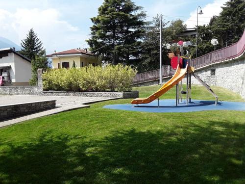 a playground with a slide in a park at Le Jasmin da Marina in Saint Vincent