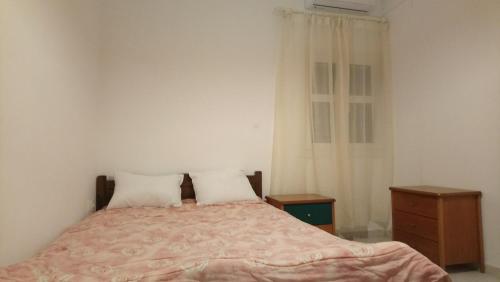 Posteľ alebo postele v izbe v ubytovaní Vacation house in Stroggili