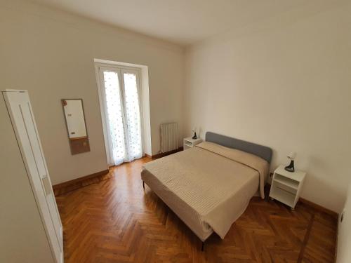 Postel nebo postele na pokoji v ubytování Villa Arcobaleno Rondò Garibaldi Sanremo