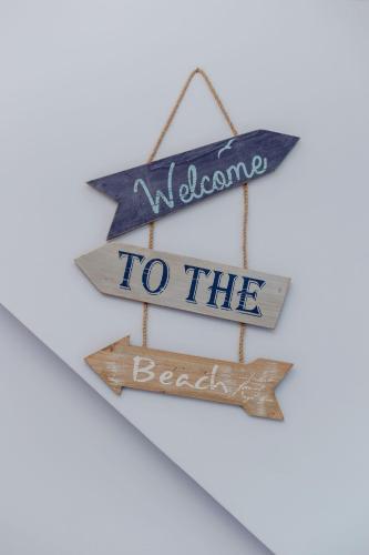 two signs that say welcome to the beach at Carlton House Portpatrick in Portpatrick