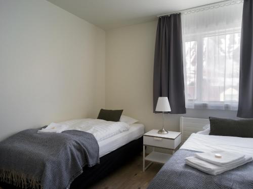 Postel nebo postele na pokoji v ubytování Salt Guesthouse