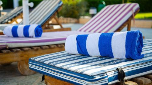two beach chairs with towels on top of them at Happy Life Village Dahab in Dahab