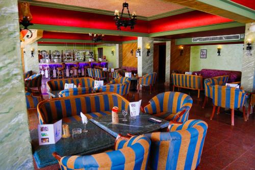 a restaurant with a table and chairs in a room at Happy Life Village Dahab in Dahab