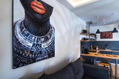 a living room with a painting on the wall at Nuovo Luxury Suite in Malia