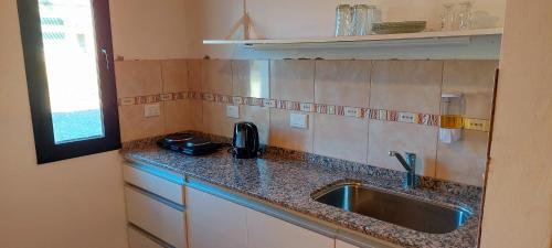 Η κουζίνα ή μικρή κουζίνα στο Cabañas Mirador del Valle Villa Giardino