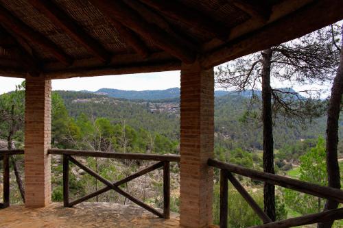 a view of the mountains from a porch at Torre del Marqués Hotel Spa & Winery - Small Luxury Hotels in Monroyo
