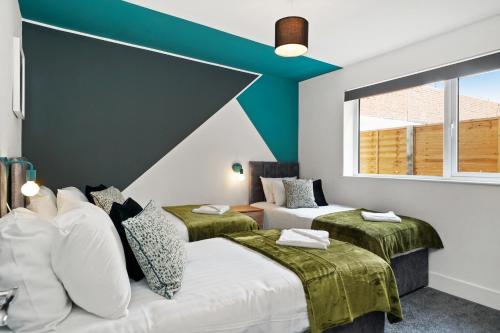 Vuode tai vuoteita majoituspaikassa Luxe Holiday Apartments by Sasco
