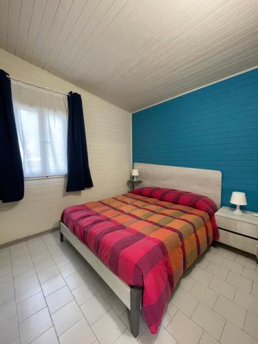 מיטה או מיטות בחדר ב-Riva dei Greci Camping Village