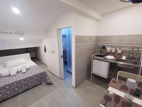 Letto o letti in una camera di Alle Mansarde