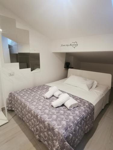 Letto o letti in una camera di Alle Mansarde