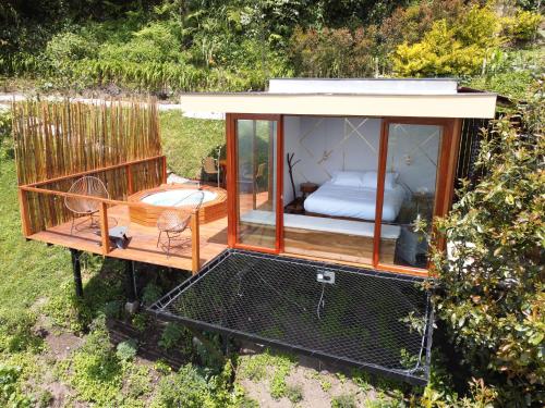 a gazebo with a bed inside of it at Nazca Glamping in Villamaría