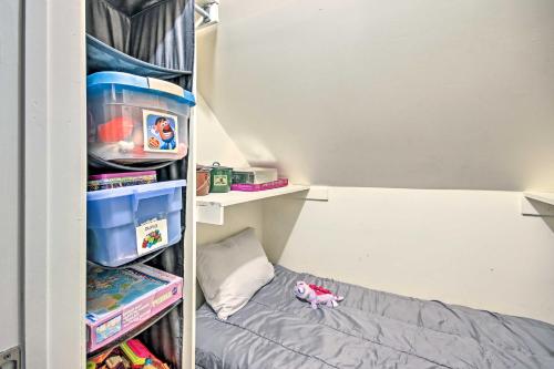 a small bedroom with a bunk bed and toys at Fire Pit and Boat Slip Waterfront Grove Getaway in Grove