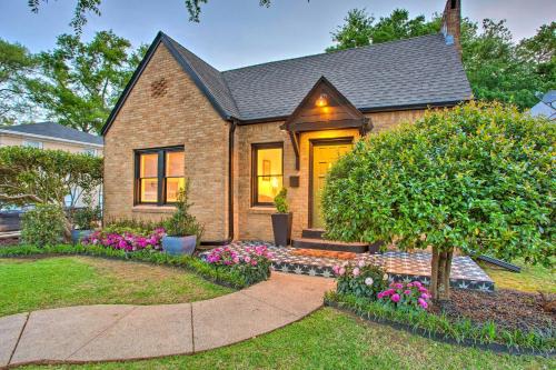 a brick house with a front door and flowers at Newly Updated and Charming Azalea District Home in Tyler
