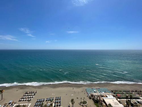 an aerial view of a beach and the ocean at Apartamentos La Roca Rentals in Torremolinos