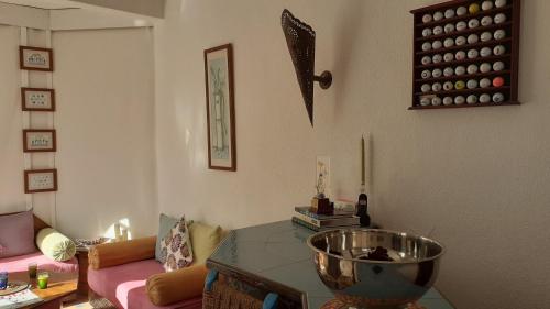 a living room with a bowl on a glass table at Villa Daba in Ghazoua
