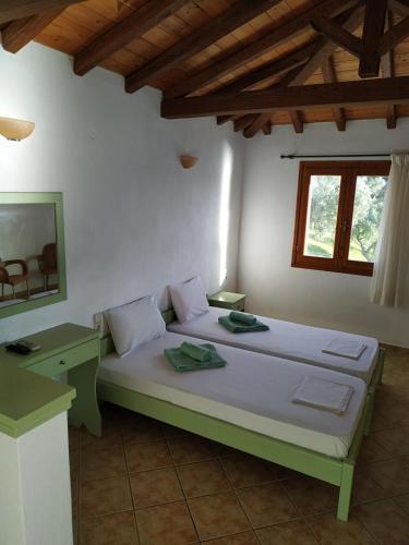 a bedroom with a large bed in a room at Ourania Sea Breath in Punta