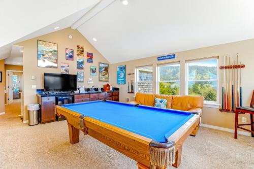 a living room with a pool table and a couch at Wind 'N Sails in Pacific City