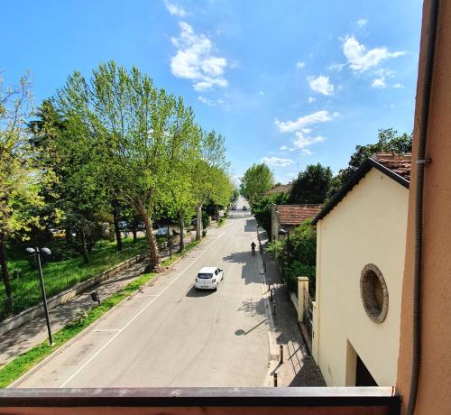 a view from a window of a street with a car at HOTEL PERLA in Massa Lombarda