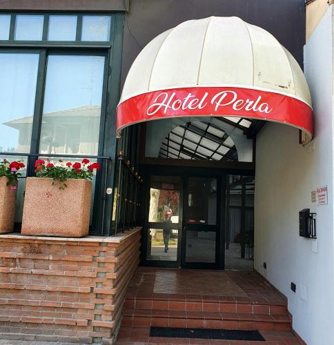 a hotel peoria sign over the entrance to a building at HOTEL PERLA in Massa Lombarda