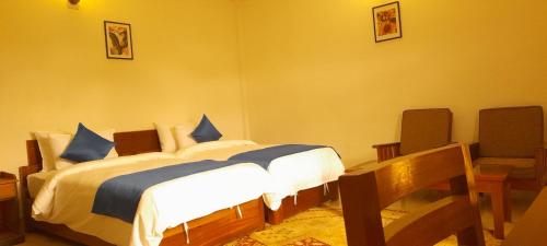 Ein Bett oder Betten in einem Zimmer der Unterkunft The Camellia