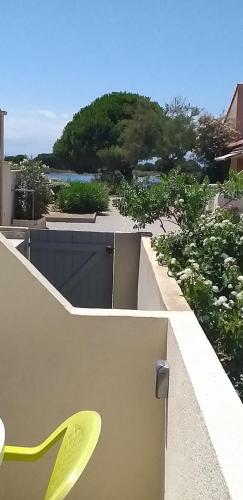 a yellow chair sitting on top of a building at MAISONNETTE AU BORD DE L ETANG in Leucate