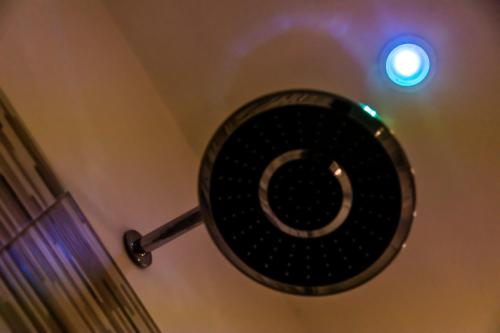 a gong hanging on a wall in a room at Rooms Dream Tropea in Tropea