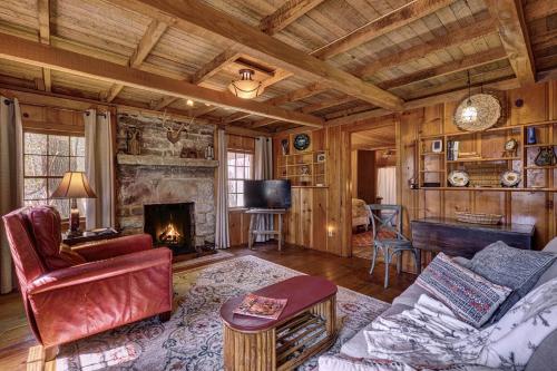 a living room with a couch and a fireplace at Rockwall in Highlands