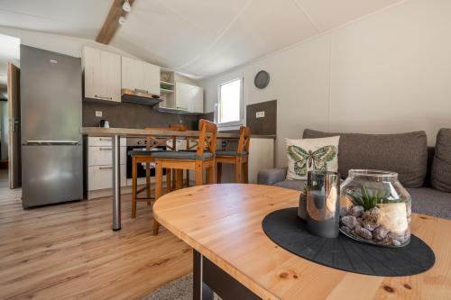a living room with a couch and a table at Mobile House Bojnice in Bojnice
