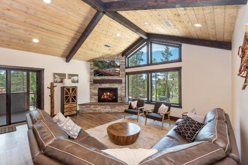 a living room with a couch and a fireplace at 001 - Living the Dream in Big Bear Lake