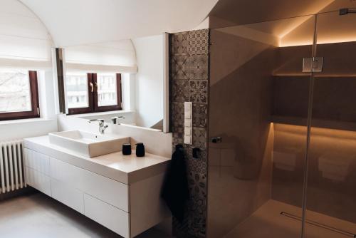 a bathroom with a sink and a shower at Orbis in Pisz