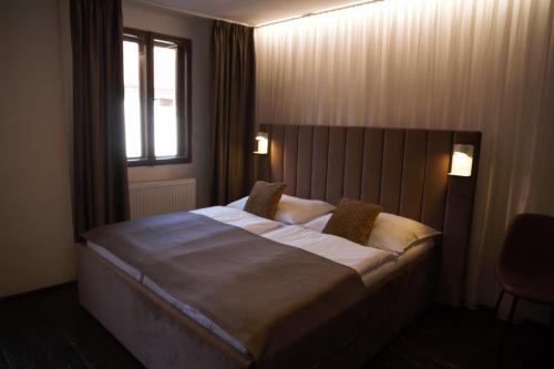 Postel nebo postele na pokoji v ubytování Hotel Svambersky dum