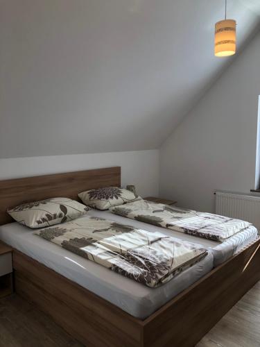 Postel nebo postele na pokoji v ubytování Apartmaji Kramar Rateče