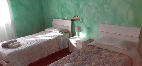 Posteľ alebo postele v izbe v ubytovaní casa papillon