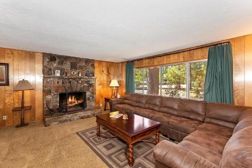 a living room with a couch and a fireplace at 049 - Mountain Time in Big Bear Lake