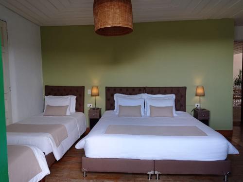 A bed or beds in a room at Hotel Gio