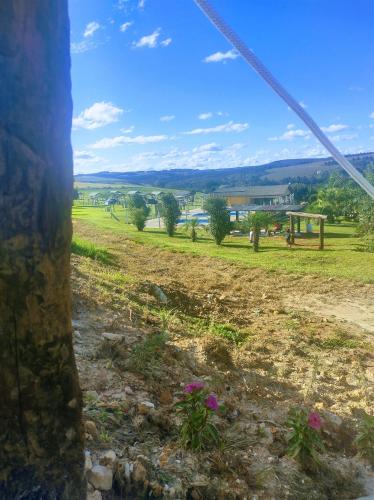 a view from a window of a field at Cachoeira do Alemão - Recanto dos Arcos in Balsa Nova