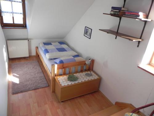 a small bedroom with a bed in a room at Haus Luise in Homberg