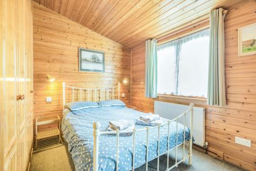Postel nebo postele na pokoji v ubytování Rosy Lodge