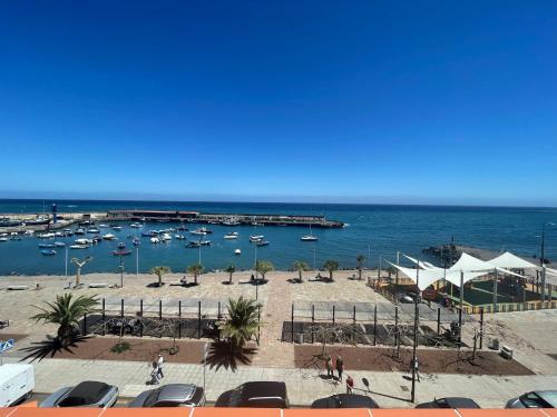 a view of a marina with boats in the water at candelaria vacaciones centro, playa 20 metros, in center holidays beach at 20 meters in Candelaria