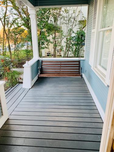 a porch with a bench on a house at Pershing Place: Historic home with heated spa/pool by Zoo, Pearl, Golf, Witte in San Antonio