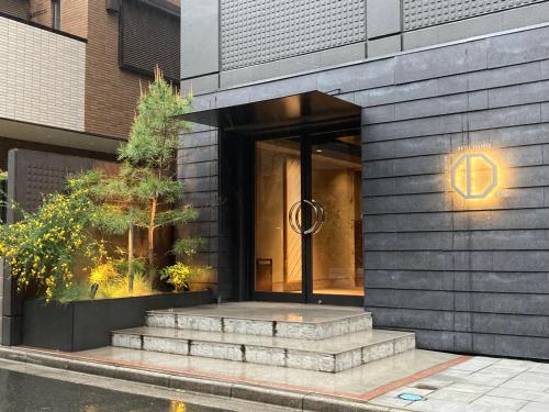 a building with stairs in front of a building at Hotel Asakusa KANNONURA in Tokyo
