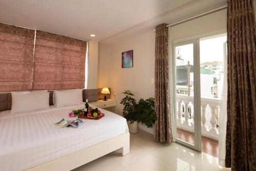 Voodi või voodid majutusasutuse Sunshine Boutique Hotel Phu My Hung toas