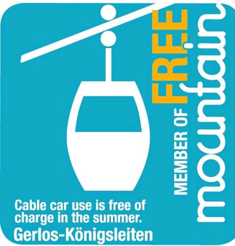 a sign that says cable car use is free of charge in the summer at Apartments Kolmblick in Gerlos