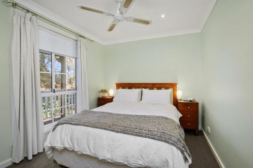 a bedroom with a bed and a window at Hilldo in Kurrajong